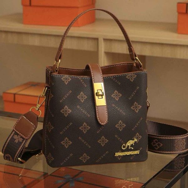 Elegant Tan Mini Top Handle Bag with Gold Hardware