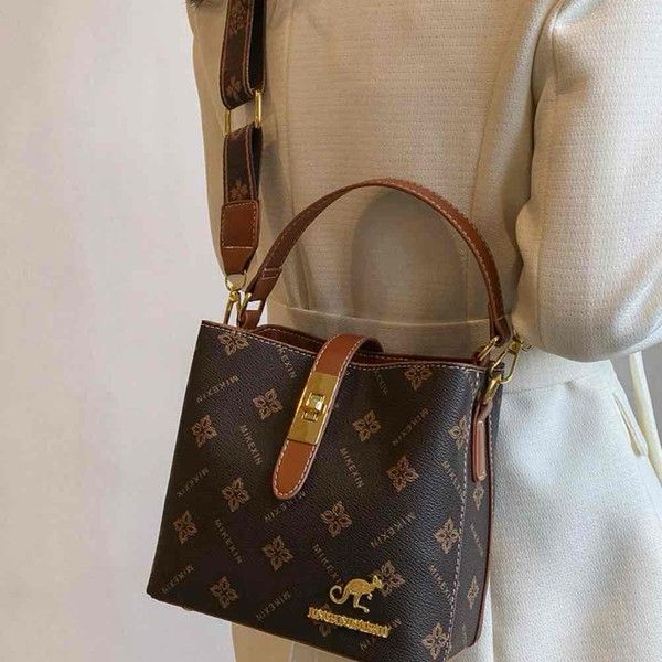 Elegant Tan Mini Top Handle Bag with Gold Hardware