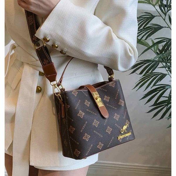 Elegant Tan Mini Top Handle Bag with Gold Hardware